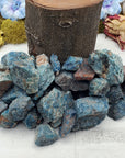 Collection of rough blue apatite stones by prop log