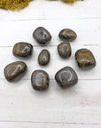Camouflage jasper stone pieces on board