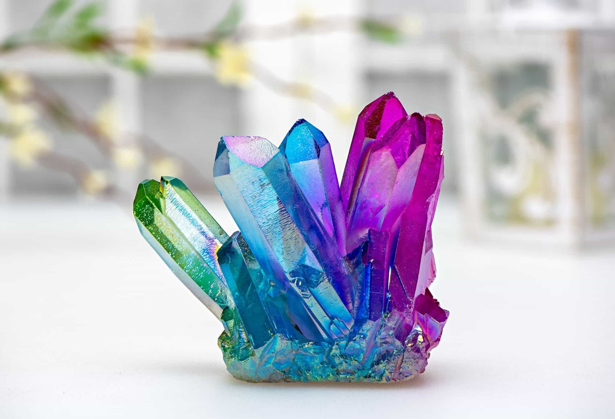 A colorful aura quartz cluster