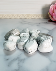 Howlite Natural Tumbled Stone - One Stone - On Tile, Close Up