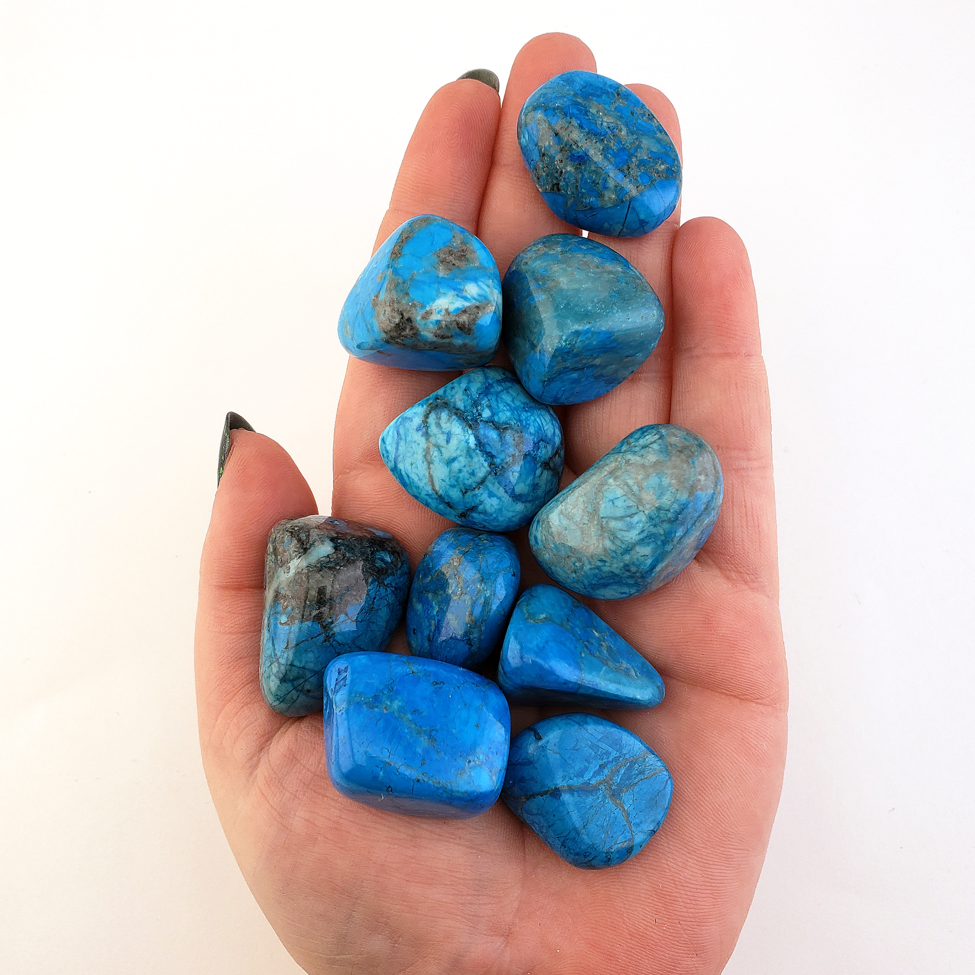Turquenite Blue Howlite Dyed Tumbled Stone - One Stone - In Hand, White Background
