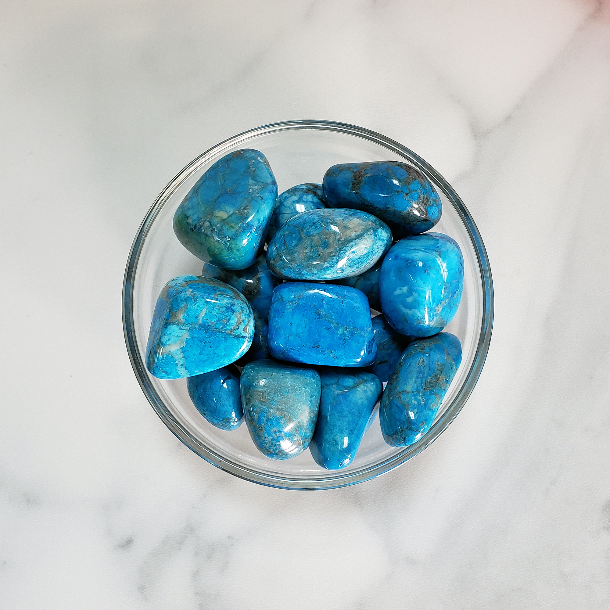 Turquenite Blue Howlite Dyed Tumbled Stone - One Stone - In Glass Bowl from Above