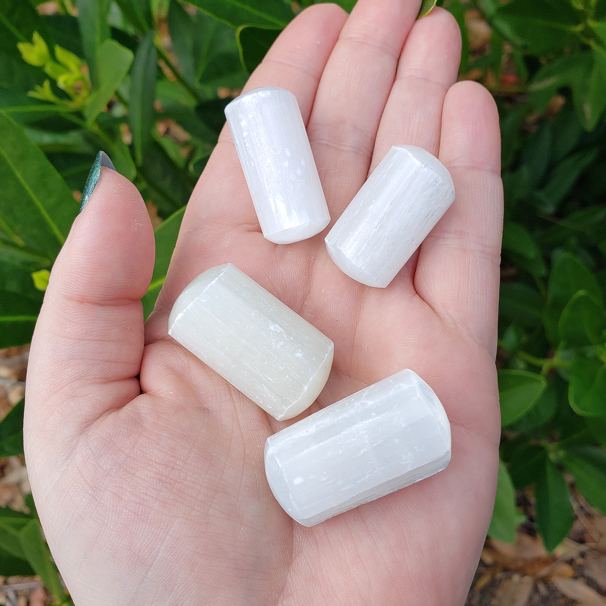Selenite Crystal Semi-Tumbled Gemstone - One Stone - In Hand in Sunlight