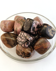Rhodonite Natural Crystal Tumbled Stone - One Stone - In Glass Bowl