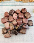 Rhodonite Natural Crystal Tumbled Stone - One Stone - Spread on Board