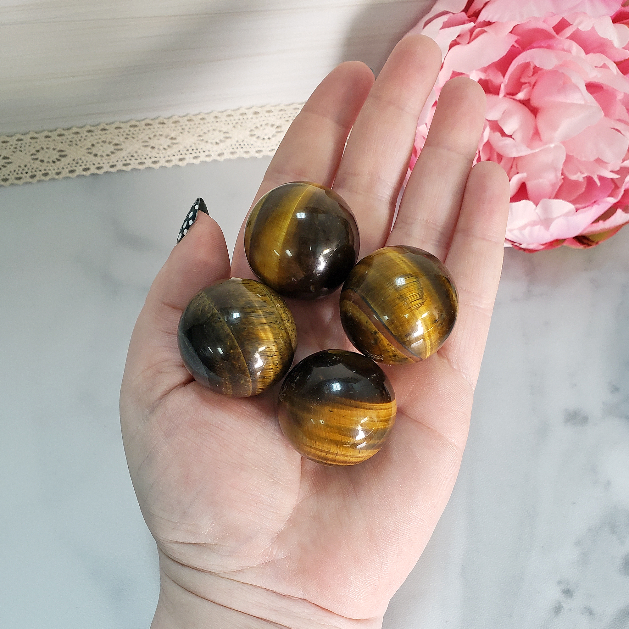 Tigers Eye Natural Crystal Sphere Gemstone Orb - One 30mm Sphere - Tiger Eye Orbs Grouped Together on Palm
