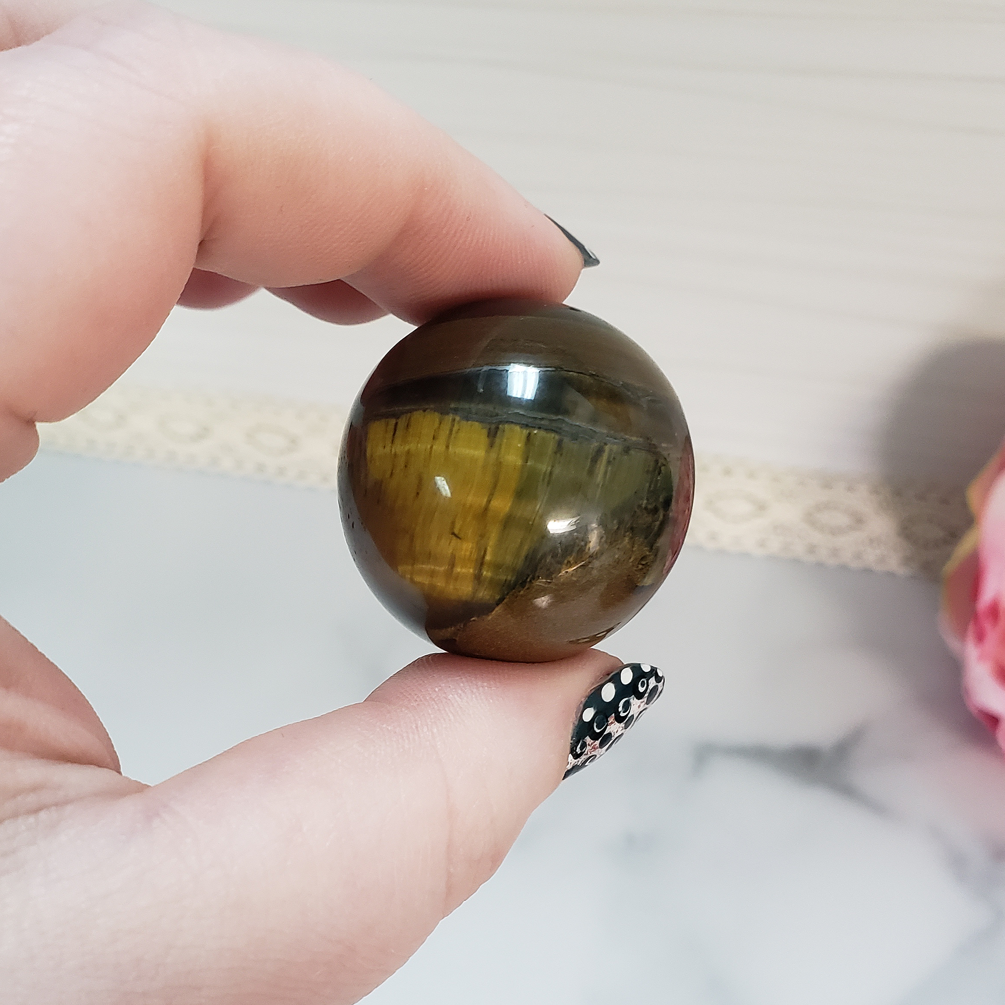 Tigers Eye Natural Crystal Sphere Gemstone Orb - One 30mm Sphere - One Tiger Eye Sphere Between Finger and Thumb