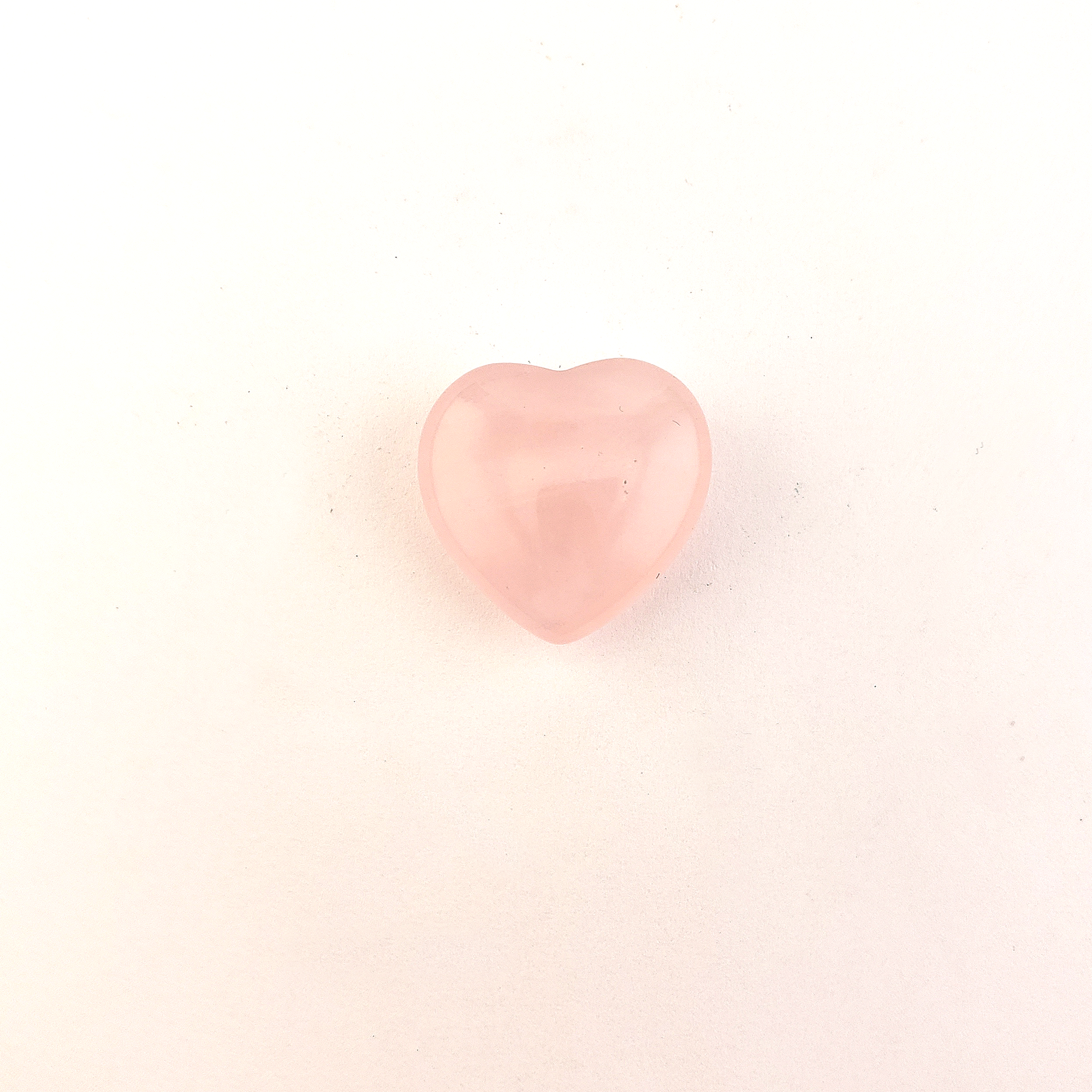Rose Quartz Crystal Natural Gemstone Heart Mini Carving - One Rose Quartz Crystal Heart on a White Background