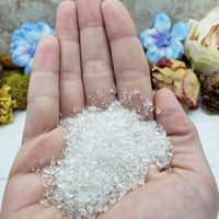 one ounce of quartz crystal chips in hand