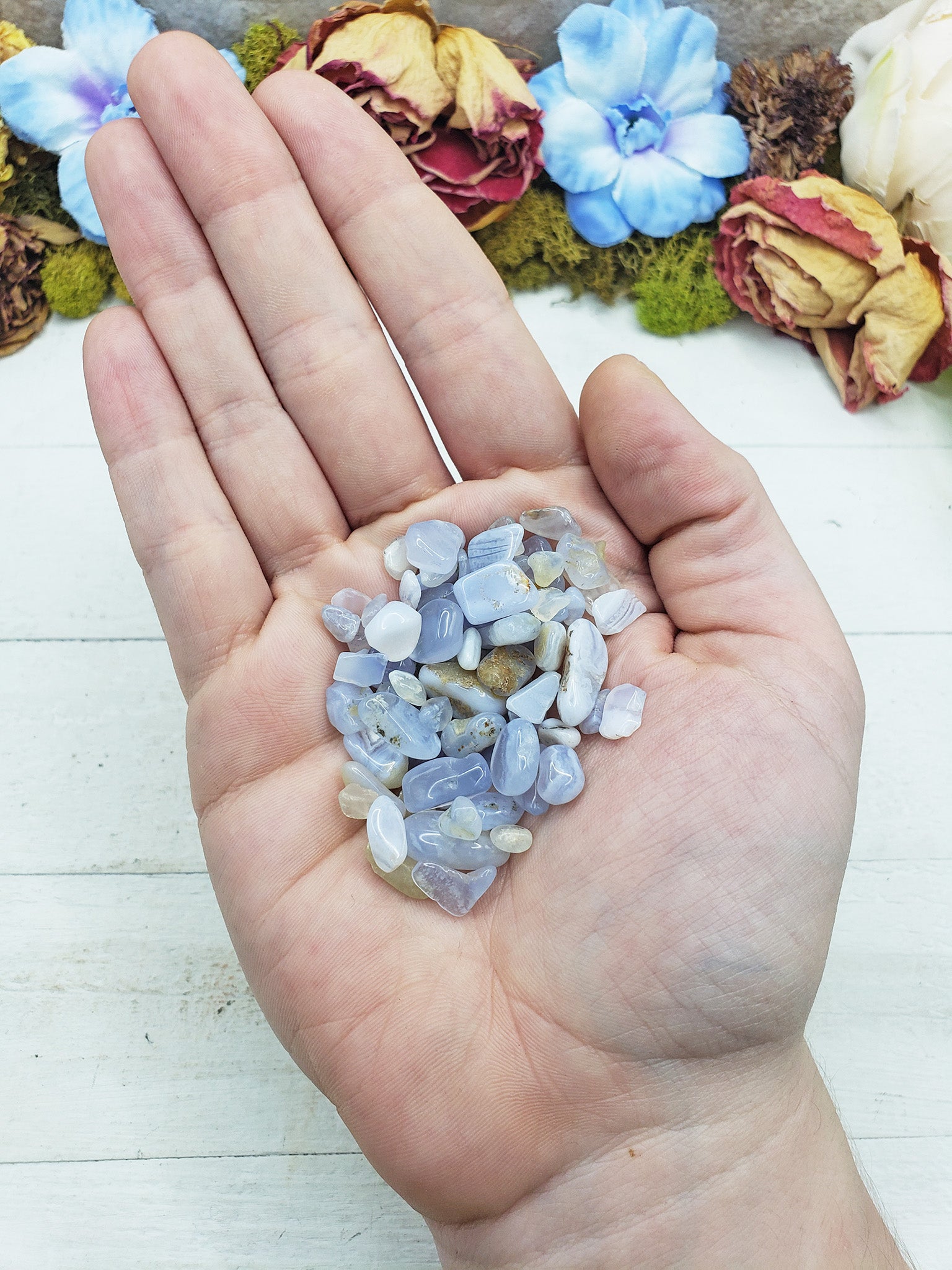 blue agate crystal chips in hand