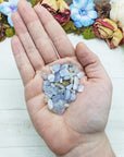 blue agate crystal chips in hand
