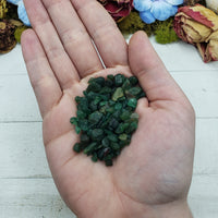 emerald crystal chips in hand