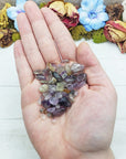 cacoxenite crystal chips in hand