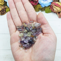 cacoxenite crystal chips in hand