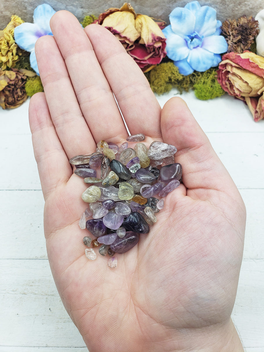 cacoxenite crystal chips in hand