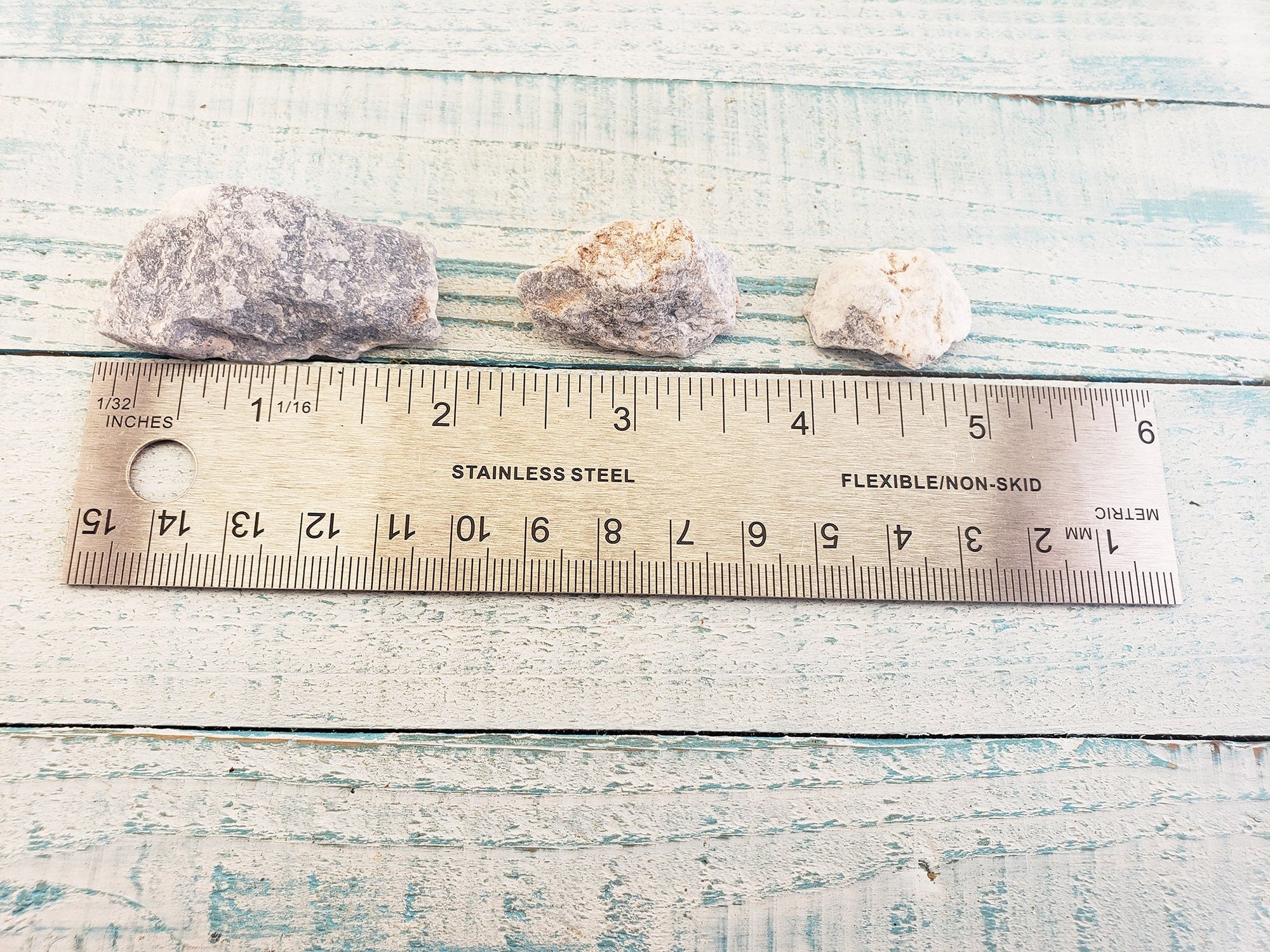 rough angelite stones by ruler