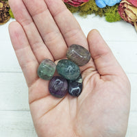 fluorite stones in hand