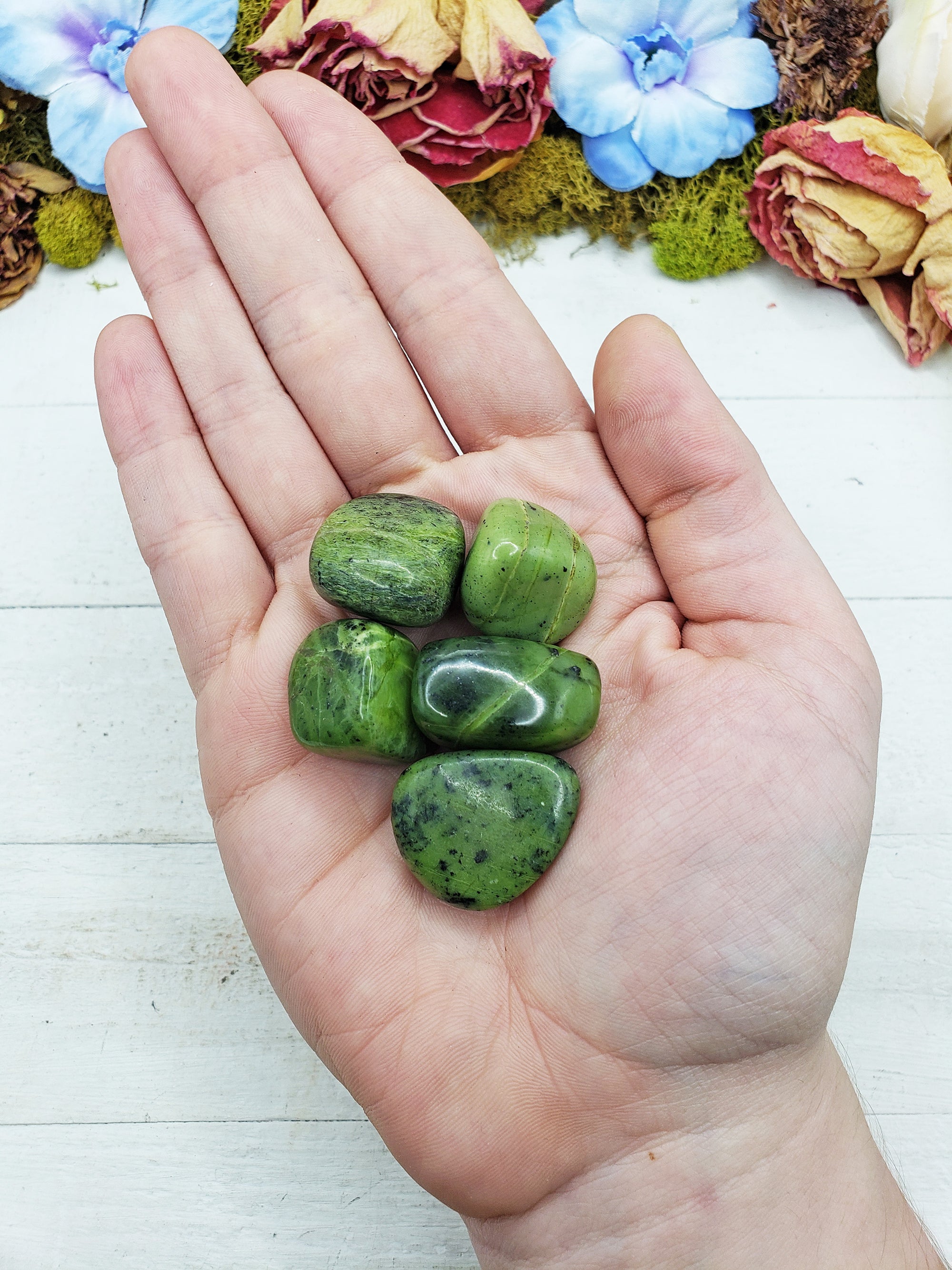 nephrite jade stones in hand