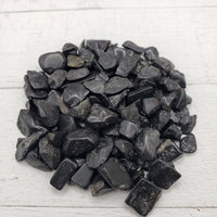 2 ounces of black tourmaline stone chips on display