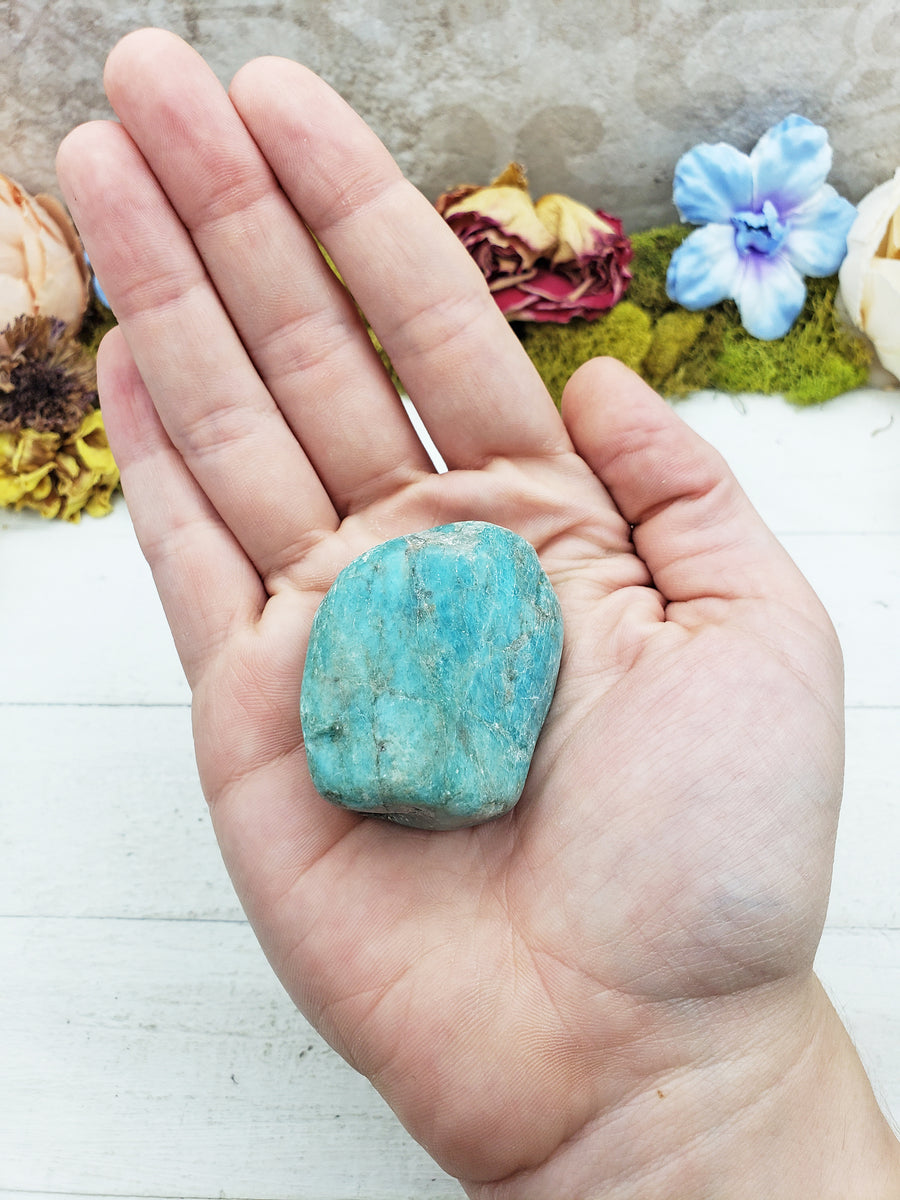 amazonite crystals in hand