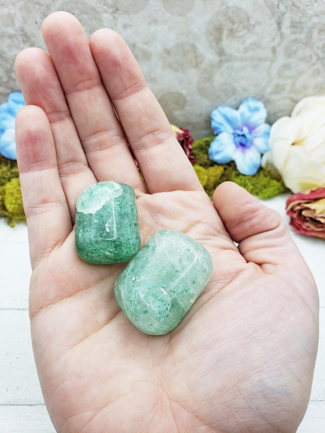 green included quartz crystals in hand