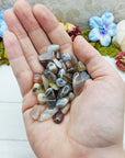 botswana agate crystals in hand