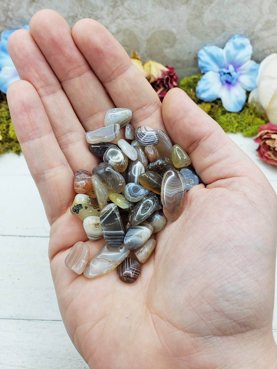 botswana agate crystals in hand