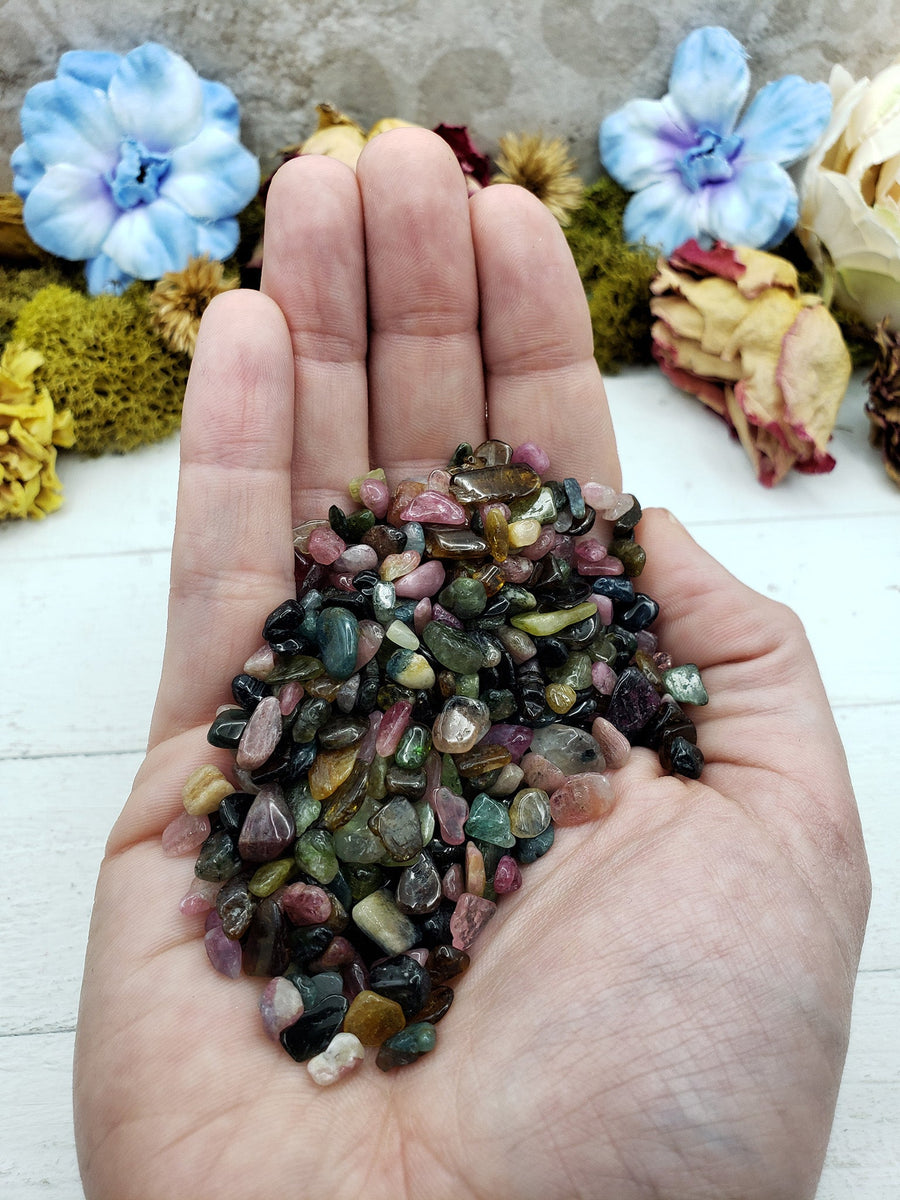 Three ounces of mixed multi tourmaline crystal chips in hand