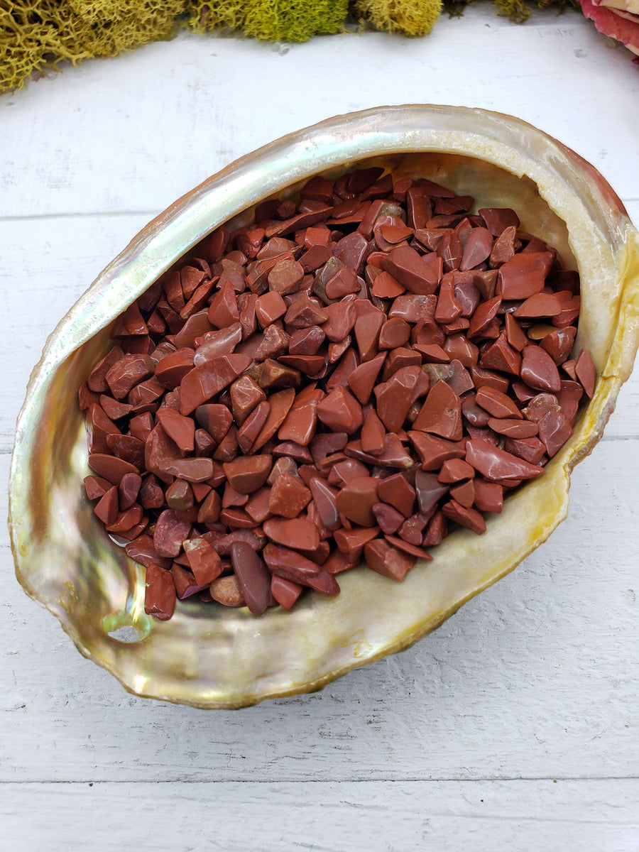 three ounces of red jasper stone chips in abalone shell