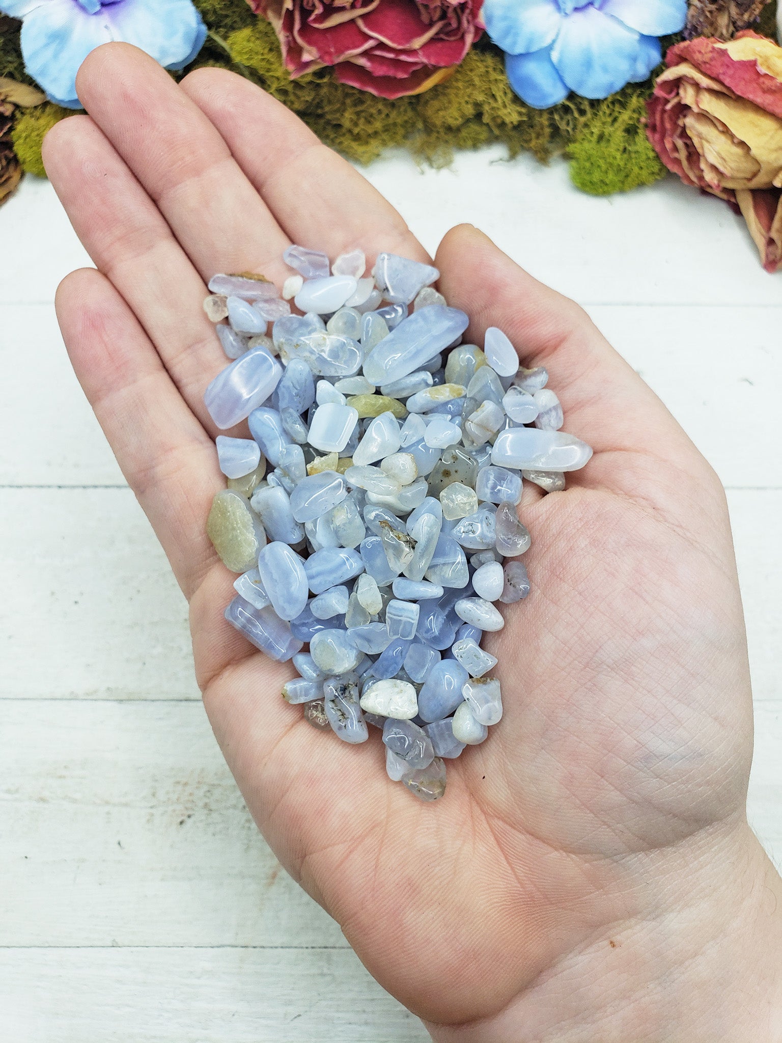 blue agate crystal chips in hand