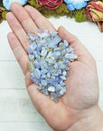 blue agate crystal chips in hand