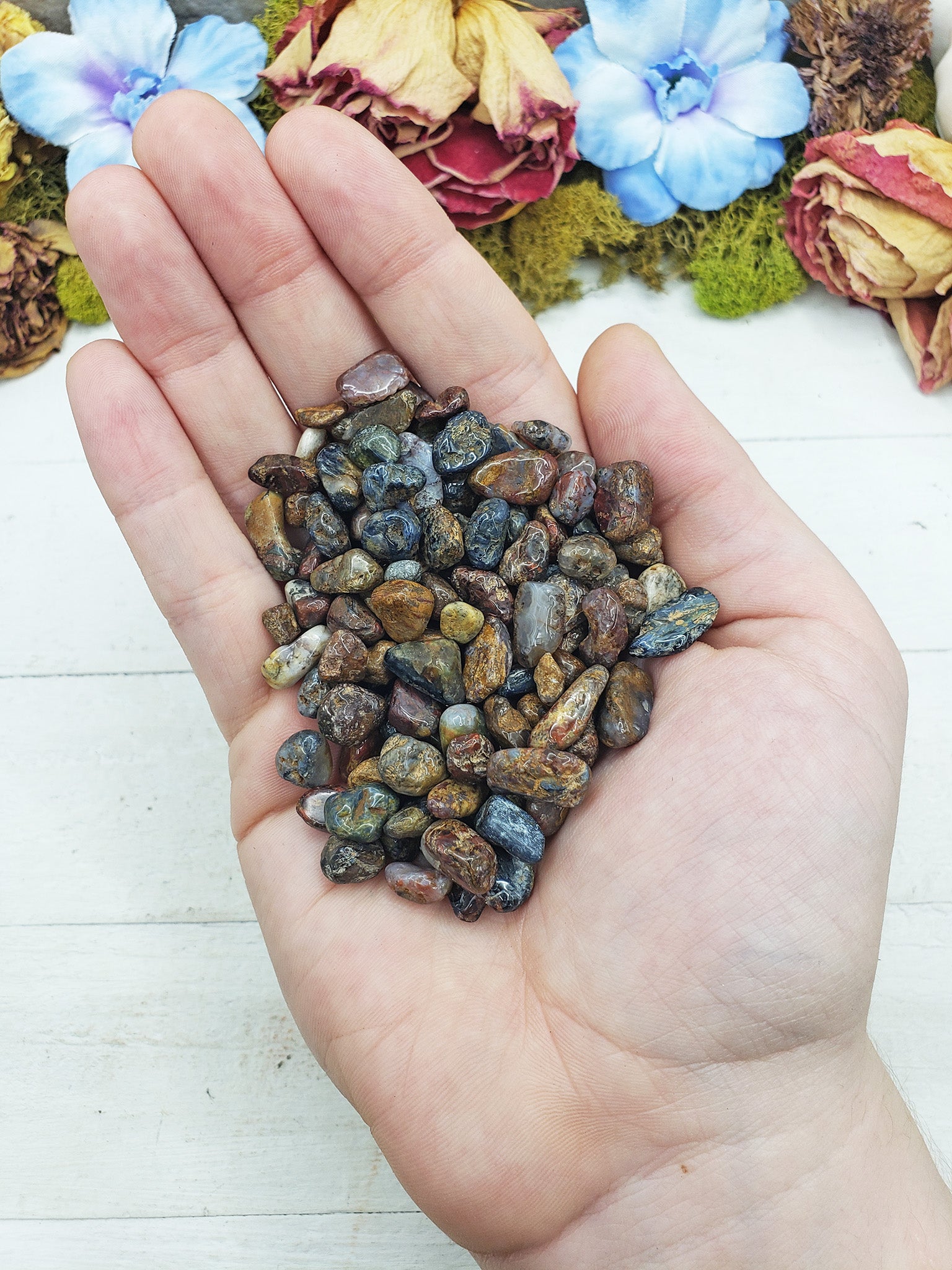 pietersite crystal chips in hand