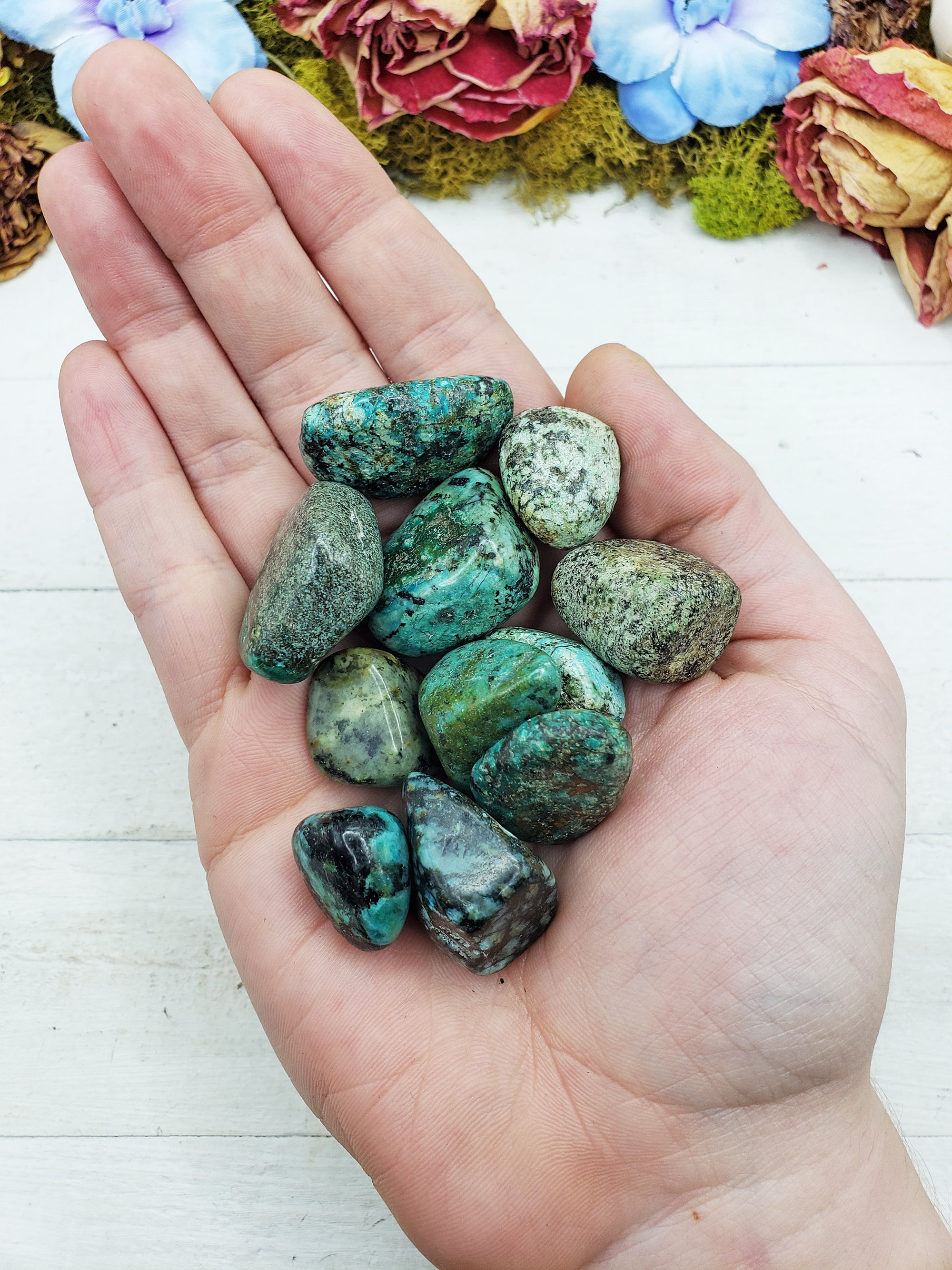 african turquoise stones in hand