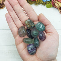 fluorite stones in hand