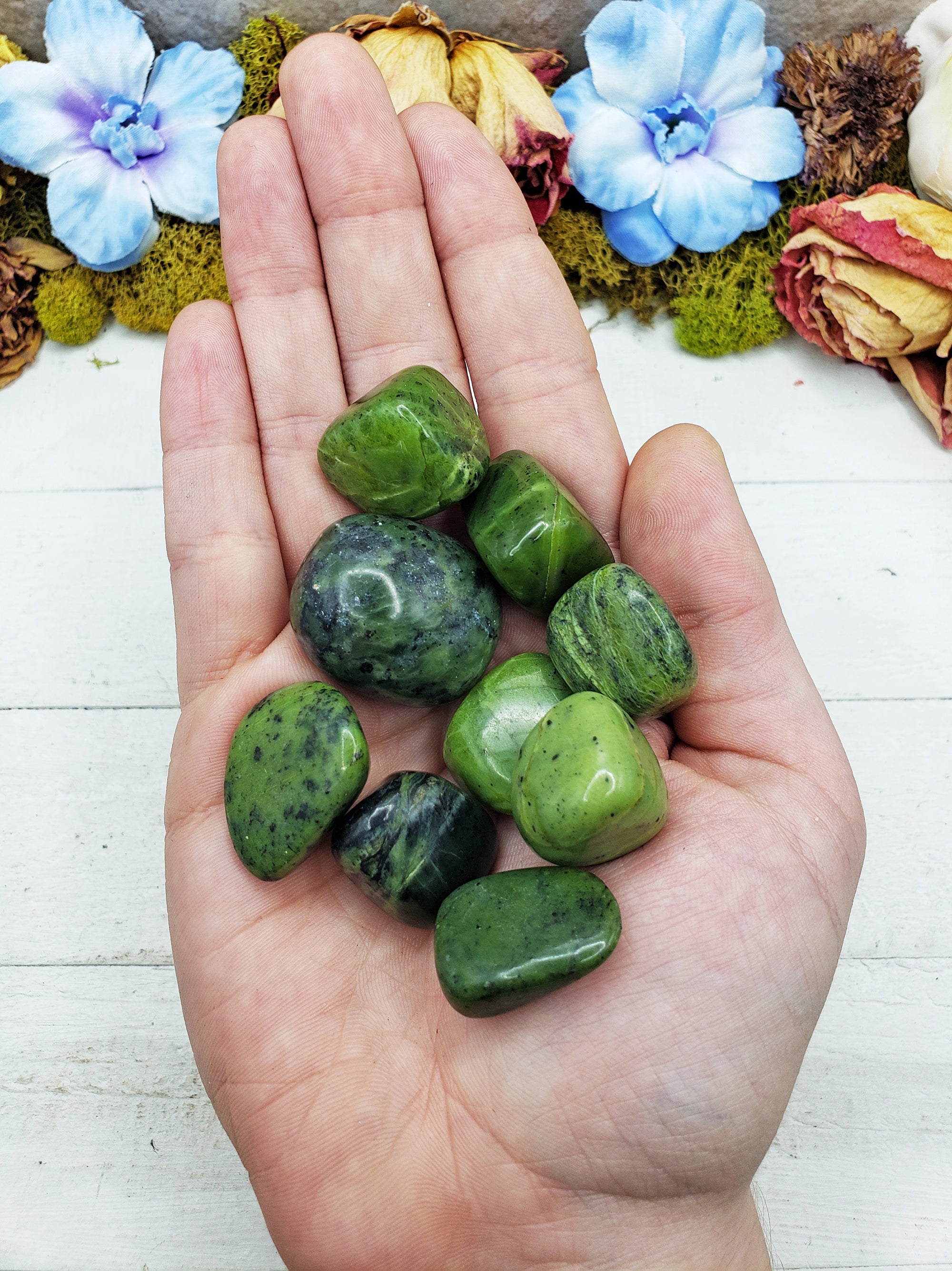 nephrite jade stones in hand