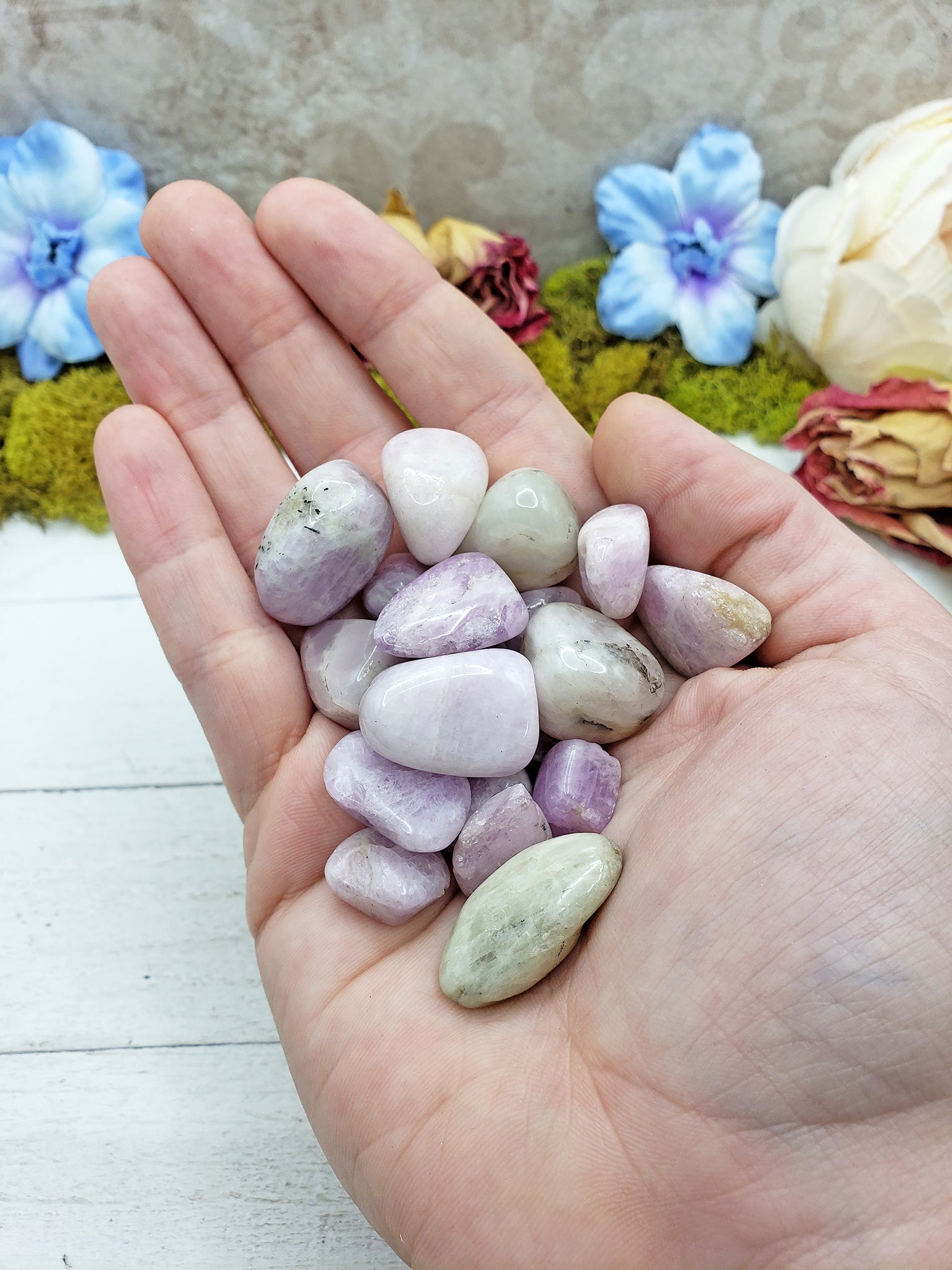 tumbled kunzite in hand