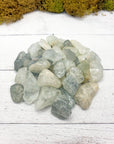tumbled aquamarine stone pieces on display