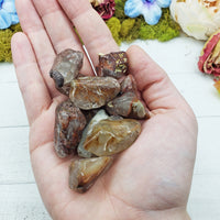 angel phantom quartz stones in hand