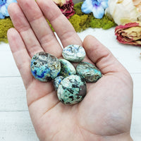 azurite malachite stones in hand