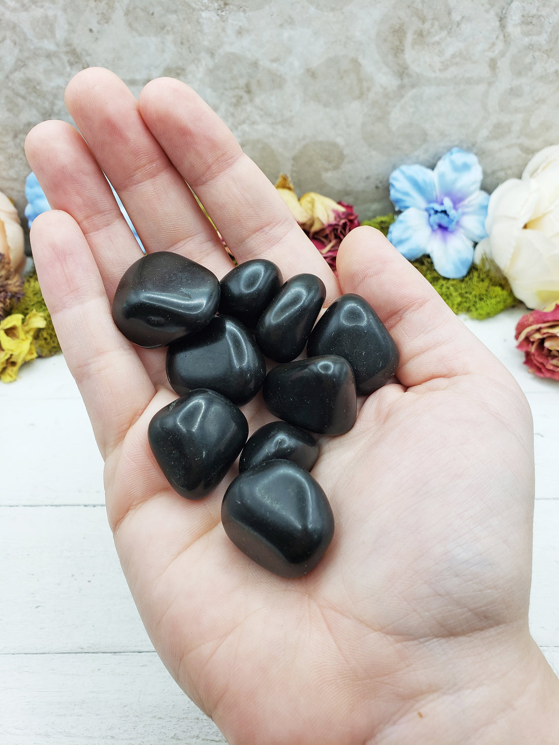 black agate stones in hand