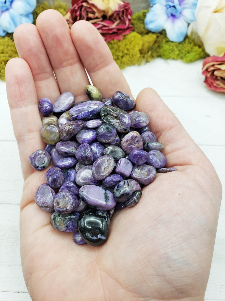 charoite stones in hand
