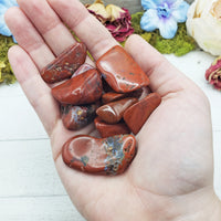 chestnut jasper crystals in hand