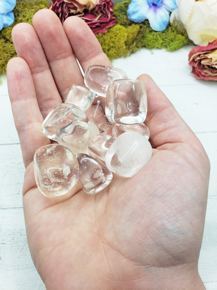 Clear obsidian stones in hand