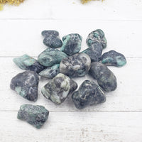 emerald in matrix stones on board