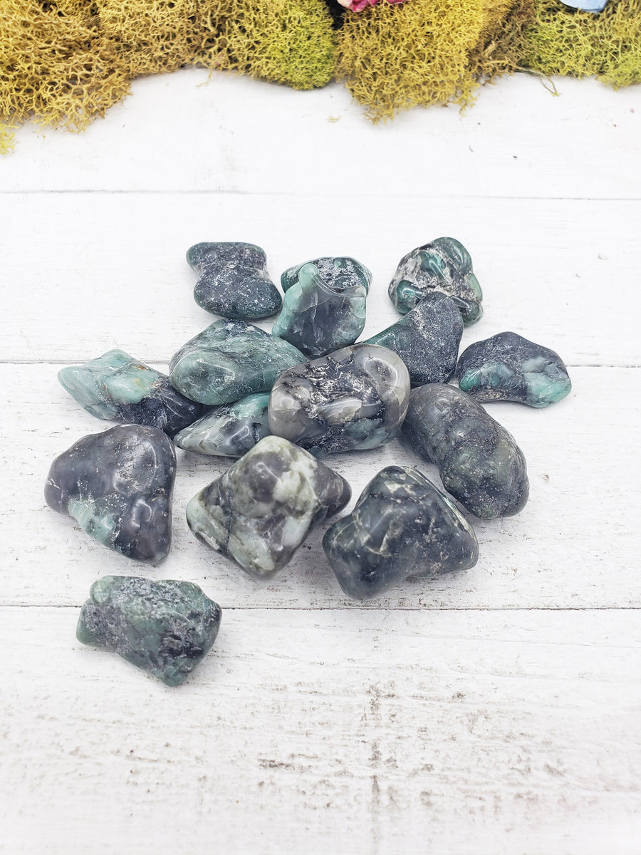 emerald in matrix stones on board