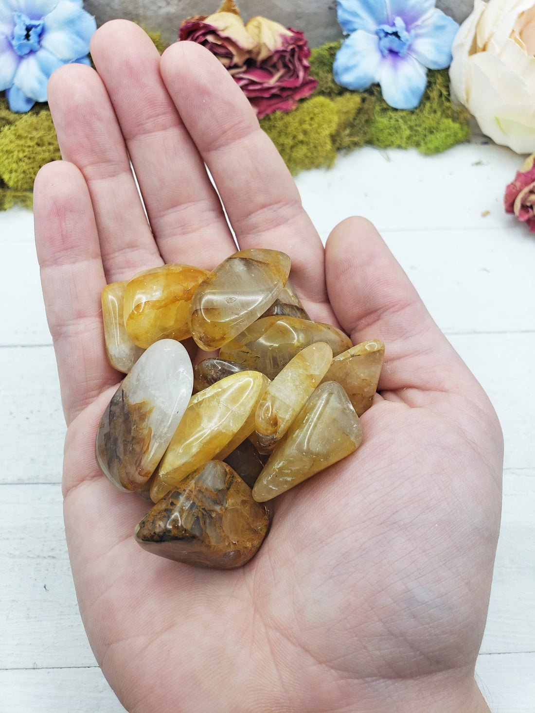 Hematoid Gold Quartz Stones in hand