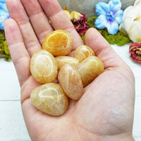 gold quartz crystals in hand