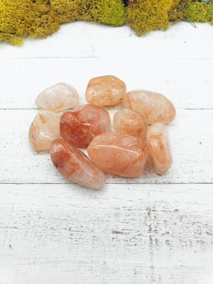 light strawberry quartz stones on board