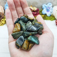 ocean jasper stones in hand