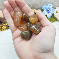 natural agate crystals in hand